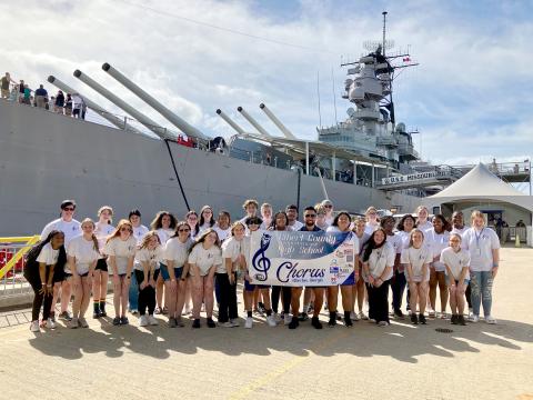 The Elbert County Chorus experienced a once-in-a-lifetime five-day trip to Hawaii and performed during the 81st annual commemoration of Pearl Harbor Wednesday, Dec. 7. Pictured in front of the U.S.S. Missouri Memorial at the Pearl Harbor Memorial in Honolulu, Hawaii are Elbert County High School Chorus members, Director Allyson Dye and the school’s tour guide.