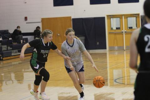 Eighth grader Audrey Lunsford takes the ball down the court during the Lady Rams’ win over Franklin County Monday. (Photo by Wells)