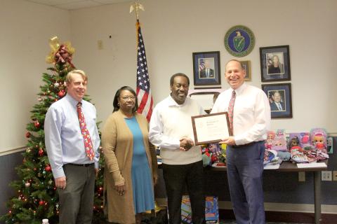 Pictured during a retirement luncheon for Freddie Baker honoring him for his 50 years of federal employment are (L-R) Southeastern Power Administration’s Leon Jourolmon, Baker’s wife Sarah, Baker and SEPA’s Virgil Hobbs. (Photo by Wells)