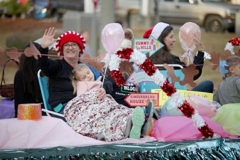 The Elbert County Chamber of Commerce held its annual Christmas parade Sunday, Dec. 4. Parade goers enjoyed festive “Candy Cane Lane” themed floats like the above from H&R Block, cars and performances from Elbert County’s Blue Devil Marching Band, cheerleaders and local dance and cheer organizations. See more photos on page 8. (Photo by Scoggins) 