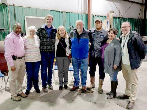 Pictured during a retirement party for former Elbert County School District Director of Transportation Mark Cartledge are (L-R) current director Darin Rucker, Peggy Cartledge, Caleb Cartledge, Carol Cartledge, Mark Cartledge, Clint Webb, Dawn Royston and Superintendent Jon Jarvis.