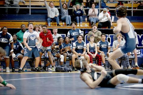 A host of Elbert County Comprehensive Mat Devils react as Carter Fleming wins a match against a Commerce opponent during the 8A Area Duals in the Inferno Jan. 7. The Devils finished third overall in the duals tournament, pitting them against the No. 2 seed, Lamar County, in the first round of the GHSA state playoffs. The first round will take place Jan. 14 at Mount Pisgah Christian School in Johns Creek. (Photo by Scoggins)