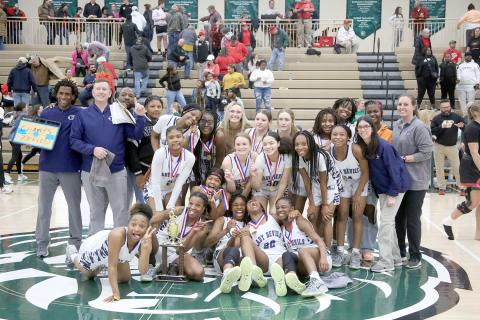 The Elbert County Lady Devils claimed the Region 8A-D1 championship trophy after defeating Rabun County 61-41 in the region tournament Feb. 17 at Piedmont University. The win came nearly one year after the Lady Devils lost the championship to the Lady Cats before ultimately defeating Rabun in the GHSA state championship. (Photo by Scoggins) 