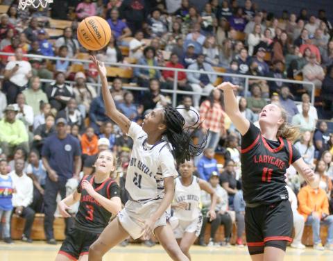 Niya Moon flies past Rabun County defenders to score during the Lady Devils win over Rabun Feb. 7. (Photo by Scoggins)