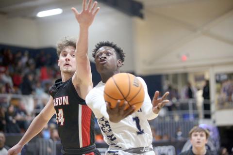 Blue Devil Bob Thomas goes for the goal during the Devils loss to Rabun County Feb. 7. The Devils claimed a spot in the Region 8A tournament and GHSA state playoffs by upsetting Commerce Monday night. (Photo by Wells)