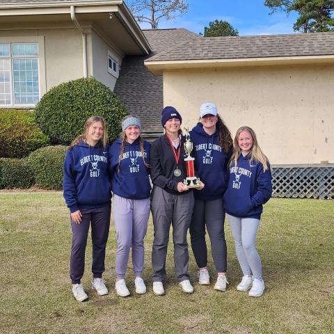 The Lady Devils golf team finished in first place in the Cougar Invitational at Mirror Lake in Villa Rica March 18. Pictured with the first place trophy are (L-R) Ellie Wheeler, Emalise Andrews, Abby Bryant, Ava Dye and Addy Evans. 