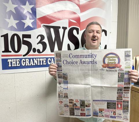 WSGC Radio station owner and operator Stan Brown encourages citizens to vote in the Community Choice Awards. (Photo by Scoggins)