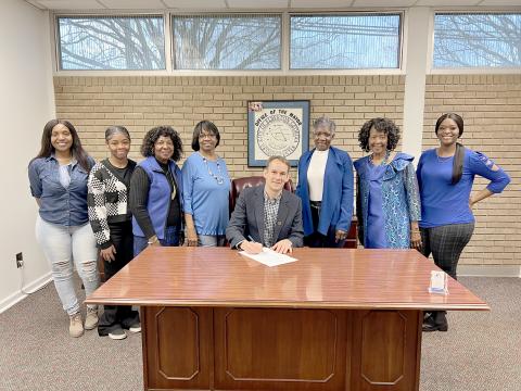 Pictured during the proclamation signing are (L-R) Sherell Eberhardt, Tiyah Turman, Edna Eberhardt, Margie Hunter, Graves, Pamela Allen, Lenora Dubose and Tiara Eberhardt. 