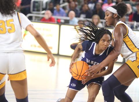 Senior Niya Moon fights past a Galloway defender during the Lady Devils’ 70-57 loss in the Final Four round of the GHSA State Tournament at Georgia College March 3. (Photo by Scoggins)