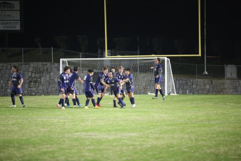 A host of Blue Devils celebrate with Juan Martinez after he scored a goal against Tallulah Falls Thursday, March 9 in the Granite Bowl.