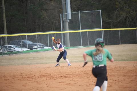 Ava Lunsford throws in a ball during the Lady Devils’ slow pitch softball game against Franklin County High School March 16. (Photo by Wells)