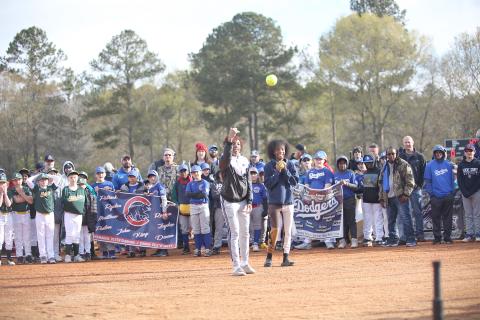 A parade of teams and coaches began the day, followed by a ceremonial “first pitch” by Elbert County Lady Devil 2022 state champions (L-R) Aaniyah Allen and Niya Moon. Lady Devils Hannah Brady and Emily Booth served as catchers. (Photo by Wells)