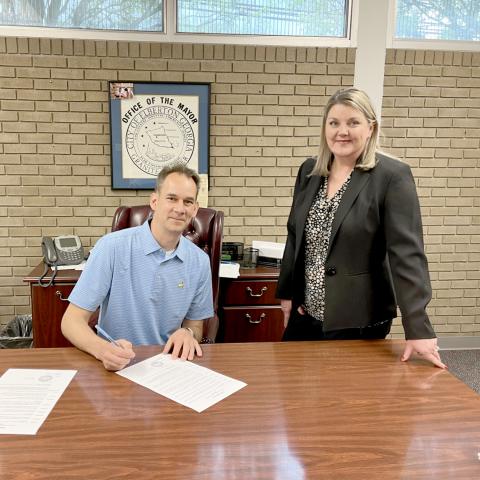 Pictured as Elberton Mayor Daniel Graves signed a proclamation to recognize April as National Child Abuse Prevention Month are (L-R) Graves and Harmony House's Jennifer Rainer.