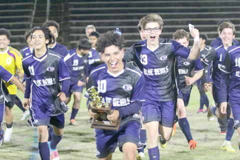 Blue Devils (L-R) Brandon Salazar (No. 11), Chapo Serna (No. 10), Nick Smith (No. 13) and Ian Lavere (No. 1) celebrate the Devils’ win over Barrow March 30 that propelled them to a historic finish as the No. 2 seed in Region 8A-D1. (Photo by Wells)