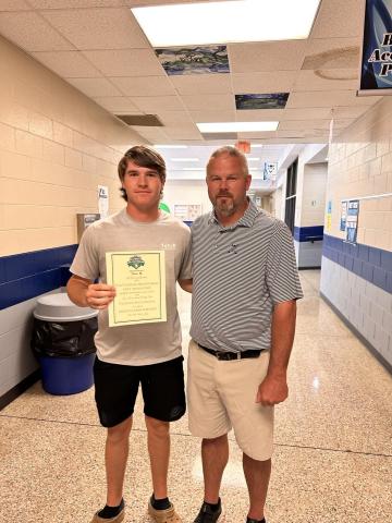 Senior Brady Starrett (left) was selected to compete for the National High School Golf Invitational recently. Starrett is pictured with Head Coach Larry Kesler. 