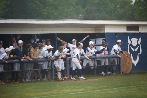 The Elbert dugout reacts as Lawson Adams steals home to score the Devils’ second run in the first game of their doubleheader against Trion April 27. Elbert won the first game 4-0 and the second game 11-2 to advance to the second round of the playoffs where they will face Social Circle May 4.  (Photo by Wells)