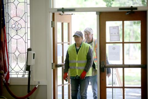 Pictured is Elrod being greeted and surprised by the crowd as she walks in the Bowman Community Center with public works employee Lloyd Ivester. (Photo by Wells)