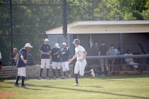Diamond Devil Lawson Adams high-fives Head Coach Lance Ingram as he trots down the third-base line following his first-inning home run in Elbert’s 8-7 loss to Social Circle in the first game of the Sweet Sixteen series. (Photo by Wells)