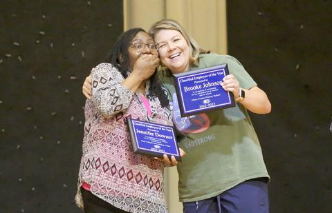 Jennifer Downer reacts to being named the Elbert County School District’s Classified Employee of the Year while receiving a hug from Brooke Johnson. (Photos by Wells) 