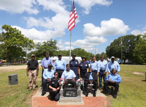 Pictured following the program are (first row) Sgt. Virginia Shelton; (second row, L-R) Charles Brawner, Frederick Walton, James Zanders and Ralph Hughes; (third row, L-R) Sam Hill, Daniel White, James Syphore, auxiliary Chaplain Della Wheeler, auxiliary member Henrietta Taggart Williams, Terry Burton, Robert Barnett and John M. Clark. (Photo by Scoggins) 