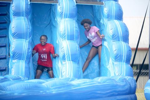The water slide brought out all smiles at McWilliams Park June 17 during the Friends Helping Friends’ second annual Football Fun Day with Mecole Hardman Jr. The event included the water slides, a mini football combine, food vendors and more. See more photos and information from the event, along with the annual Friends Helping Friends Bekkah FHF VBS Camp at Rock Branch Baptist Church on page 6. (Photo by Wells) 