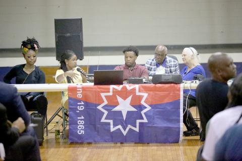 Juneteenth round table speaker Anissa McIntosh (second from left) speaks to a crowd in the Mill Street Gym during the event hosted by the Martin Luther King Jr. Committee June 19 as (L-R) Myiah Davis, Gilbert Fortson, John Clark and Donna Webb listen on. (Photo by Wells) 