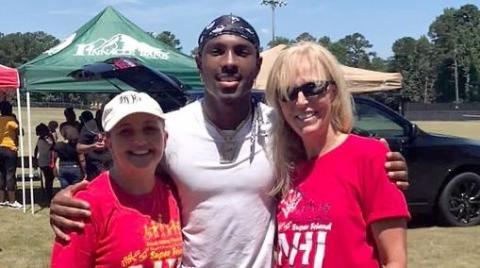 The Friends Helping Friends annual Football Fun Day with Mecole Hardman will take place Saturday, June 17 from 9 a.m. until noon. Pictured during the 2022 event are (L-R) Devon Davis, Hardman and Sandy Adams. 