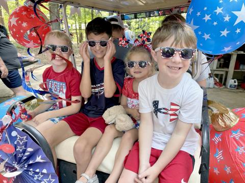 Pictured during the parade are (above, L-R) Max Truitt, Jace Merena, Lillie Chicken and James Truitt.