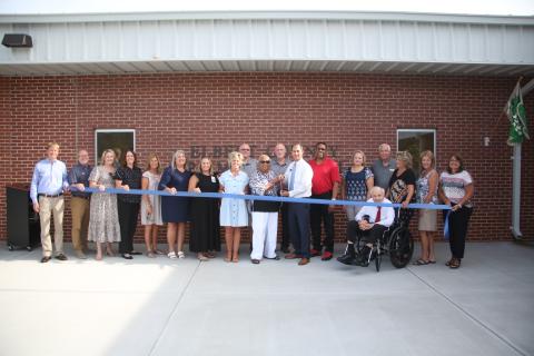 Pictured during the July 19 ribbon cutting at Elbert County Primary School are (front row, L-R) Josh Atkinson of Carroll Daniel Construction, Jon Jarvis, Amanda Lucas, Rebecca Long, Haley Oakley, Susan Fortson, Hannah Williams, Christy Hart, Theresa Barnett, Robert Wheeler, Kam McClary, Heather Nestor, Phillip Hart, Pamela Eaves, Patricia Graham and Bridgette Matthews and (back row, L-R) Keith Harper, Mike Turner and David Hunt. (Photo by Wells)