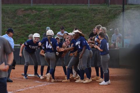 Miller Drake (No. 14) is greeted by her teammates at the plate after smashing a home run to center field during Elbert County’s 9-8 loss to Franklin County Aug. 15. (Photo by Shane Scoggins, Franklin County Citizen