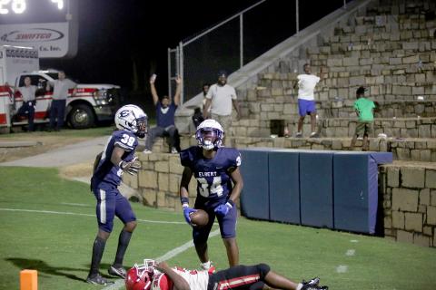 Sophomore Jaylen Davis (No. 39) celebrates with freshman Exavier Jones (No. 34) and a handful of Blue Devil fans following a pair of late-game touchdowns that led the Blue Devils to a 22-10 victory in the pre-season scrimmage against Stephens County in the Granite Bowl Aug. 4. (Photo by Wells)