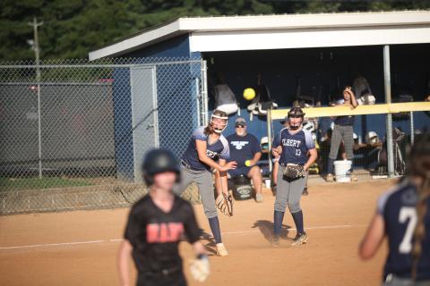 Haley Jones (right) looks on as Ella Harris (left) tries to throw a Hart County runner out at first base Aug. 17. Elbert went on to lose 15-6 to Hart, but got back into the win column with an 11-1 win over Washington-Wilkes Aug. 19. (Photo by Wells)