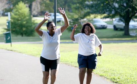 Edna Eberhardt (right) celebrates with Vanica Harper (left) following a “fun run” as part of the Elbert County Colon Cancer Support Group’s walk/fun run Saturday, Sept. 9 in Sutton Park. Throughout the walk, participants read signs with information regarding statistics and signs and symptoms of colorectal cancer. (Photo by Scoggins)