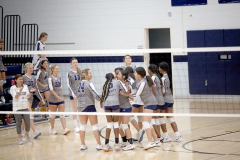 The Lady Rams volleyball team celebrates after Sophia Vargas gets an ace to seal a victory over Habersham Sept. 6. The Lady Rams controlled the match from start to finish as they won the first set 25-12 and the second set 25-11. (Photo by Wells) 