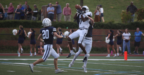 D.K. Winn makes a leaping catch in double coverage during Elbert County’s 45-40 win over Mount Vernon Sept. 29. (Photo by Wells)