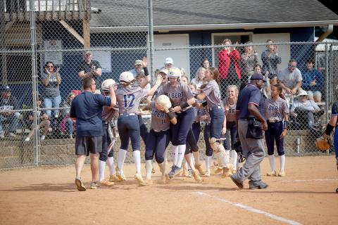 The Lady Devils swarm Ky Dubose at the plate after she hit a home run in Elbert’s game against Trion Oct. 19.  (Photo by Wells)