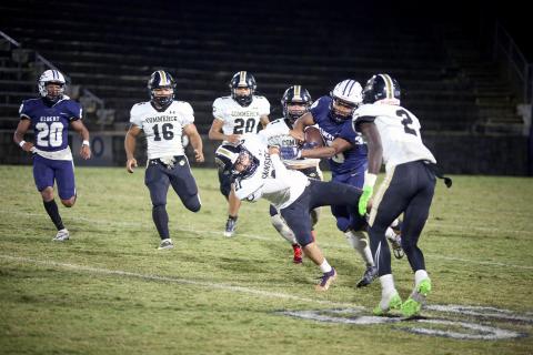 Miguel Rodriguez runs through a Commerce defender during a 34-yard return in Elbert’s win over Commerce Oct. 20. (Photos by Wells)
