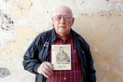 Elberton’s John N. “Pete” Anderson, 88, holds a photo of him taken aboard a ship at Fort Lewis, now Joint Base Lewis-McChord in Tacoma, Washington before being shipped off to Korea in 1958. (Photo by Scoggins) 
