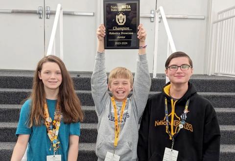 Pictured are (L-R) the Book Battle team members, who also participated in the Robotics Showcase, Chloe David, Levi Wiles and Adrian Jenkins.