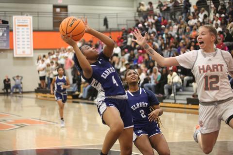 No. 4 Kaylen Rucker leans away from a Hart County defender as she gets a shot up in Elbert’s loss to Hart County. (Photo by Wells)