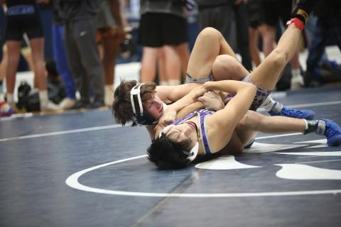 Carter Fleming fights to pin an opponent during the Granite City Duals hosted by Elbert County Dec. 9. (File photo by Wells)