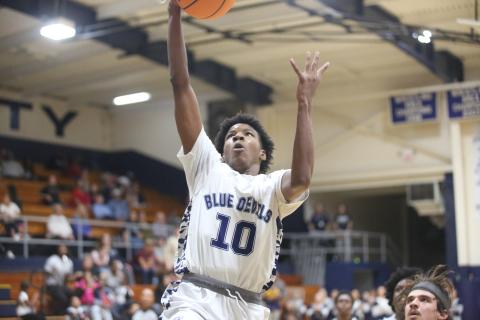 A.J. Brown punctuates an Elbert fast break with a slam dunk. (Photos by Wells)
