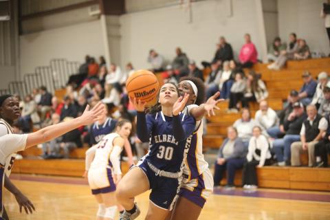 Miya Hood lays the ball into the basket after getting by an Athens Christian defender. (Photo by Wells)