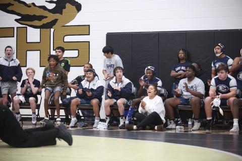 The Elbert bench reacts after teammate Brycin Hughes pins a Towns County wrestler during the area championship Jan. 13 at Commerce High School. (Photo by Wells)
