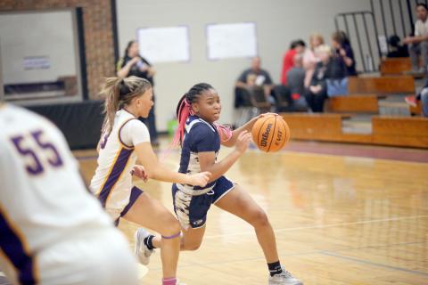 Kaylen Rucker pushes past an Athens Christian defender during Elbert’s loss to Athens Christian in the Region 8A Division tournament. (Photo by Wells)