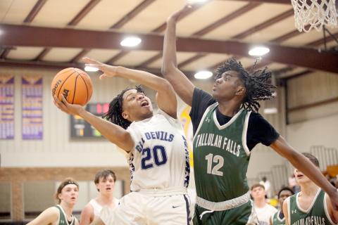 Landon Hill goes up with the ball in front of a Tallulah Falls defender during Elbert’s win over the Indians in the Region 8A Division 1 tournament. The Devils finished in third place during the tournament behind a team-high 20 points from Hill. (Photo by Wells) 