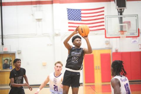 D.K. Winn shoots a three during Elbert’s first-round loss against Oglethorpe. (Photo by Wells)