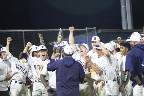 Head Coach Lance Ingram presents the Devils with the region championship trophy after they clinched the region with a win over Commerce last season. This year’s Diamond Devils team started the year ranked in the Top 10 in Class A Division 1 and are 1-0 in region play after a win over Tallulah March 4. (File photo by Wells)