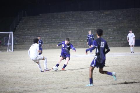 Jace Terrell kicks the ball past an opponent. (File photo by Wells)