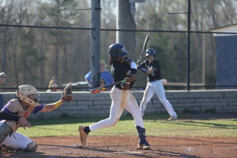  Cheyvis McLendon makes contact with the ball during Elbert’s first game against Athens Christian March 29. (Photo by Scoggins))